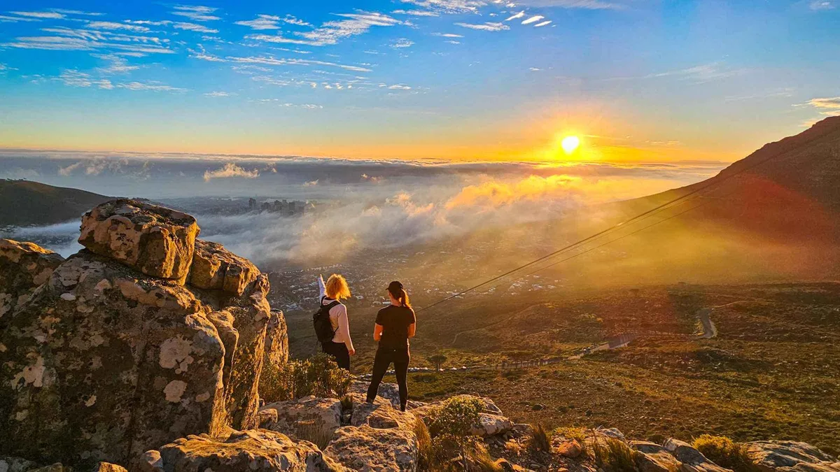Hikers on a rocky trail during a guided Table Mountain summit hike above Cape Town