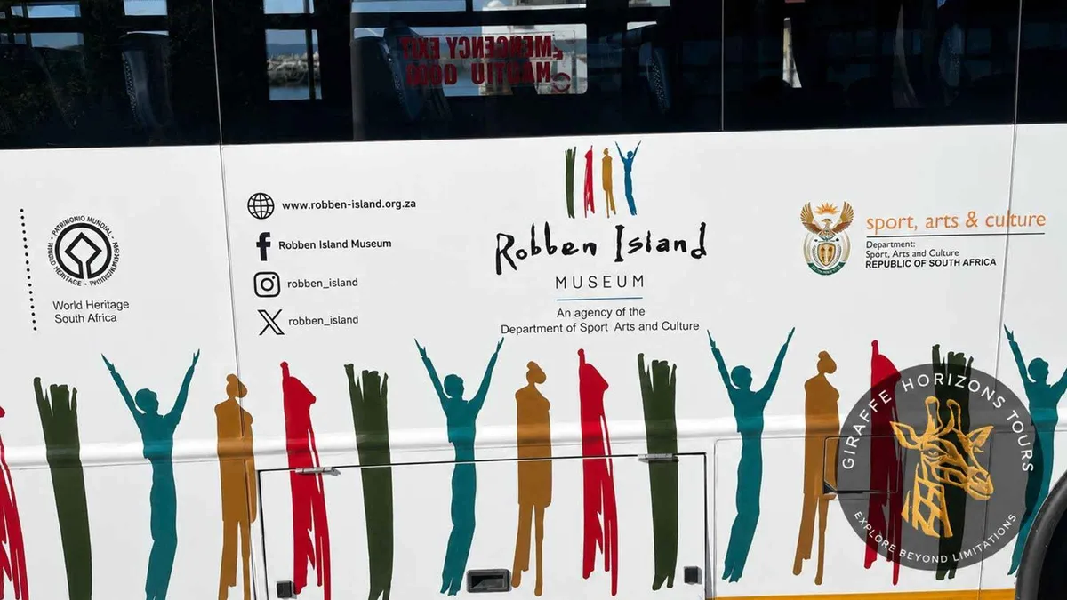 Visitors at Nelson Mandela's former cell on a Robben Island ferry and prison tour from Cape Town