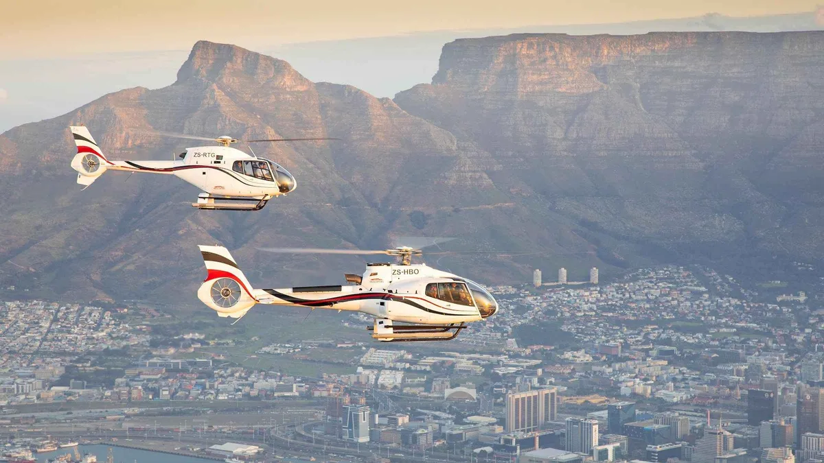 Helicopter lifting off the V&A Waterfront helipad for a sightseeing flight over Cape Town