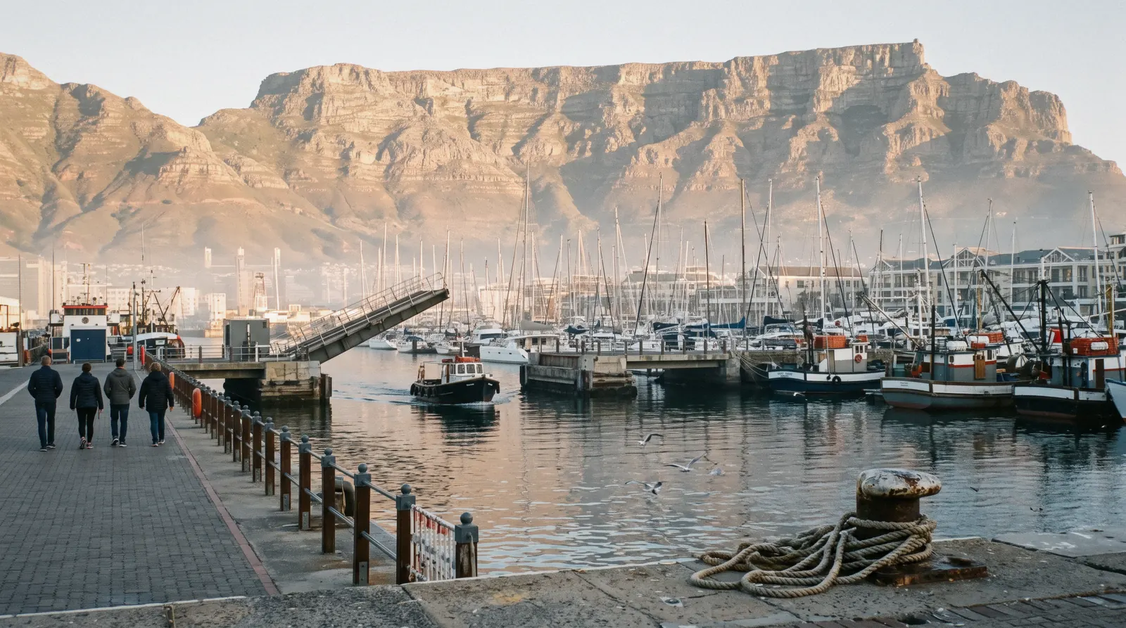 Fishing boats and the swing bridge at the V&A Waterfront harbour with Table Mountain behind, V&A Waterfront Cape Town