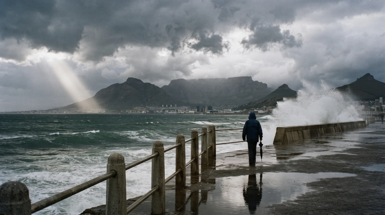 A winter cold front clearing over Table Bay with sun on wet streets, the swing of Cape Town weather by month